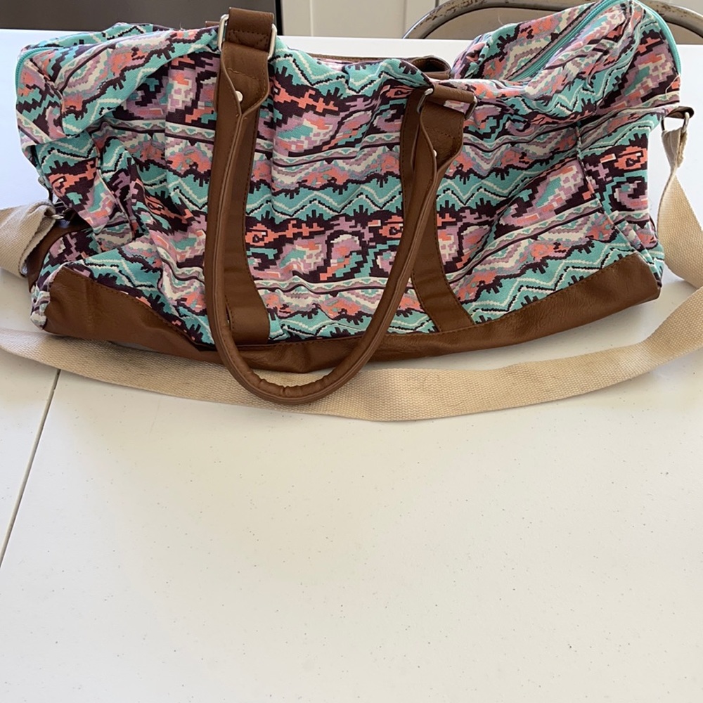 Duffel bag with strap